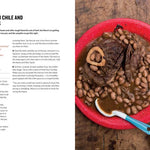Red plate with beef shanks and cranberry beans on a wooden surface, accompanied by text on the left.