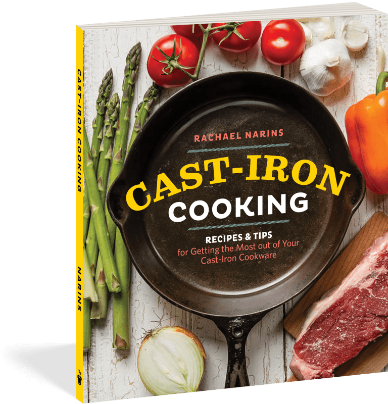 Book cover of 'Cast-Iron Cooking' with a cast-iron skillet, vegetables, and meat on a wooden surface.
