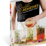 Book titled 'Sweet Remedies: Healing Herbal Honeys' with a person pouring honey into jars on the cover.