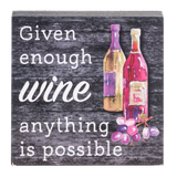 wooden block with painting of wine bottles and a bunch of grapes next to a phrase stating "given enough wine anything is possible" on a clear background