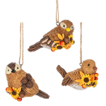 Three bird-shaped ornaments with autumn elements on a white background