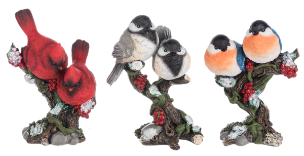 Set of three decorative bird figurines on branches with flowers against a white background