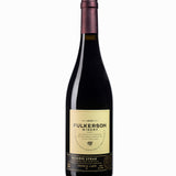 Wine bottle with 'Fulkerson' reserve Syrah label on a white background