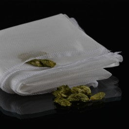 White paper towel with green leaves on a black background