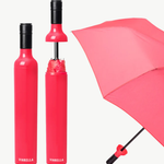 Pink umbrella with black handle and shaft on a white background