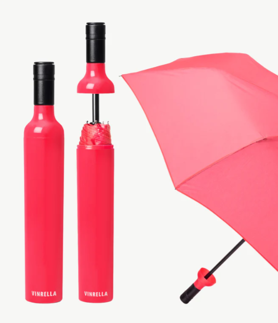 Pink umbrella with black handle and shaft on a white background
