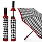 Black and white houndstooth patterned umbrella with red accents on a white background