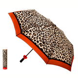 Leopard print umbrella with orange trim on a white background