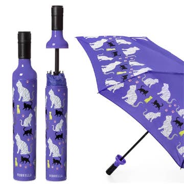 Purple umbrella with cat pattern on a white background