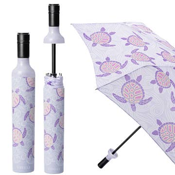 Collapsible umbrella with turtle pattern on a white background