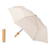 Beige umbrella with wooden look handle on a white background