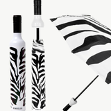 Zebra-patterned umbrella with white handle and base, displayed open and closed.