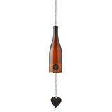 Brown glass wine bottle wind chime hanging ornament with a heart charm on a white background