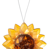 Sun-shaped decorative ornament with a central brown circle on a white background