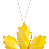 Yellow leaf-shaped ornament on a white background
