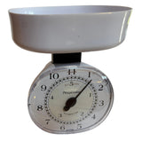 Dial scale with white bowl on a plain background