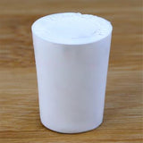 Solid rubber stopper on a wooden background