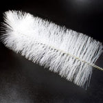 White bristle brush on a black background