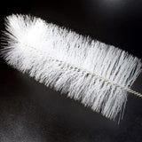 White bristle brush on a black background