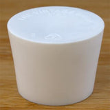 Solid rubber stopper on a wooden background