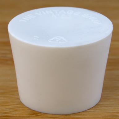 Solid rubber stopper on a wooden background