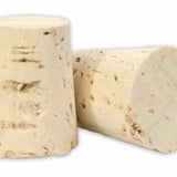Two cork stoppers on a white background