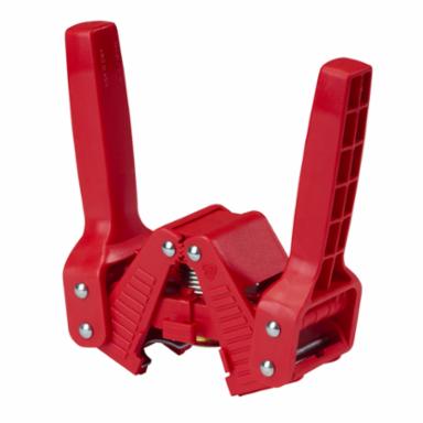 Red plastic capping tool with multiple components on a white background