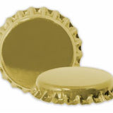 Gold bottle crown caps on a white background