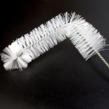 White bottle brush on a black background