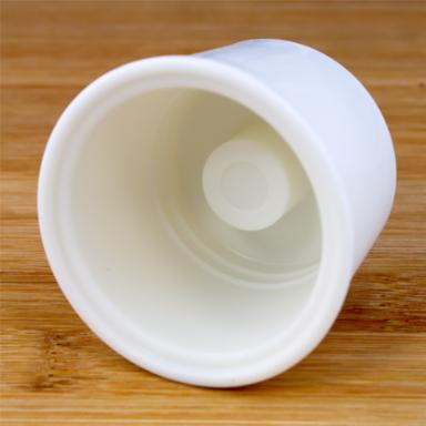 Solid universal rubber stopper on a wooden background