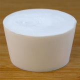 Solid rubber stopper on a wooden background