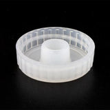 Clear plastic cap on a black background