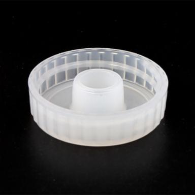 Clear plastic cap on a black background