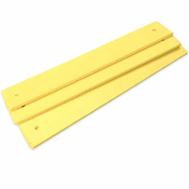 Yellow sulfur coated cotton strip on a white background