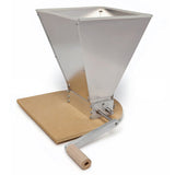 conical tool with handle on a rotating axle with a wood platform on a white background