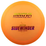 Orange sidewinder disc golf disc with 'innova' branding on a transparent background