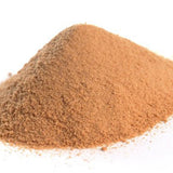 Pile of brown powder on a white background
