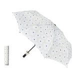 Grey umbrella with white flowers and black centers and matching handle on a white background