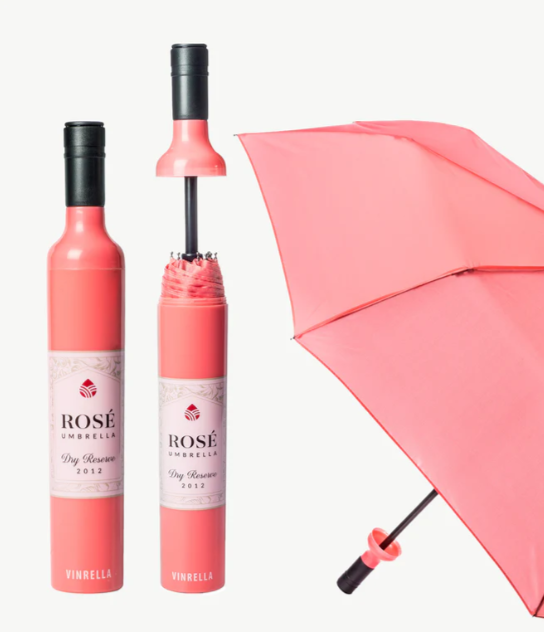 Pink rose-shaped umbrella with bottle design on a white background